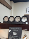 Vintage-style interior with wooden desk, decorative items, and wall clocks.